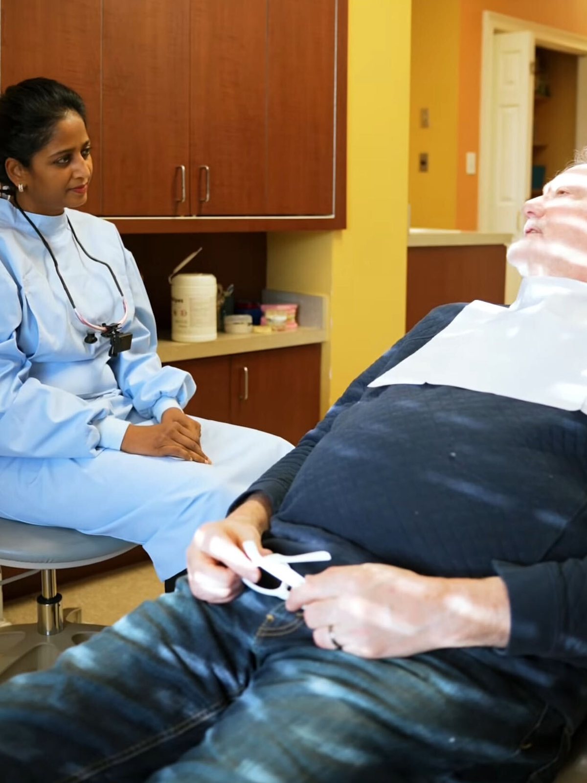 Dr. Madhavi Bhoompalli with a patient in the treatment room